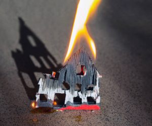 Burning house, home fire insurance concept.